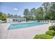 Community pool with lounge chairs and covered area, a great place to relax and enjoy the outdoors at 2513 Hunters Trail, Myrtle Beach, SC 29588