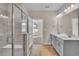 Spa-like bathroom featuring a walk-in shower and double vanity at 301 Broughton Dr., Myrtle Beach, SC 29579