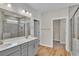 Elegant bathroom with double vanity, large mirror, and walk-in shower at 301 Broughton Dr., Myrtle Beach, SC 29579