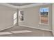 Spacious bedroom with neutral carpet and tray ceiling at 301 Broughton Dr., Myrtle Beach, SC 29579