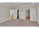 Bedroom with carpet, walk-in closet, and access to kitchen at 301 Broughton Dr., Myrtle Beach, SC 29579