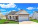 Charming craftsman style home with a two-car garage and manicured lawn at 301 Broughton Dr., Myrtle Beach, SC 29579