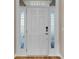 Modern front door with sidelights and a keyless entry system at 301 Broughton Dr., Myrtle Beach, SC 29579