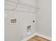 Functional laundry closet with wire shelving and utility hookups at 301 Broughton Dr., Myrtle Beach, SC 29579
