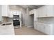 Bright kitchen with white cabinets, marble countertops, and stainless steel appliances at 375 Log Cabin Rd., Loris, SC 29569