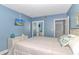 Stylish bedroom with TV, closet, and soothing blue color scheme at 1605 S Ocean Blvd. # 410, Myrtle Beach, SC 29577