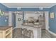 Updated kitchen with granite countertop island, stainless steel appliances and modern lighting at 1605 S Ocean Blvd. # 410, Myrtle Beach, SC 29577