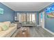 Inviting living room featuring sleek floors, modern furnishings, and access to the outside balcony at 1605 S Ocean Blvd. # 410, Myrtle Beach, SC 29577