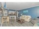 Open concept living area with a view of the kitchen, offers relaxed seating and a calming color palette at 1605 S Ocean Blvd. # 410, Myrtle Beach, SC 29577