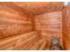 Inviting sauna room with wood paneling, tiered benches, and a traditional stove at 1605 S Ocean Blvd. # 410, Myrtle Beach, SC 29577