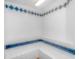 Clean sauna featuring all white tile and blue accents in diamond and rectangular patterns at 1605 S Ocean Blvd. # 410, Myrtle Beach, SC 29577