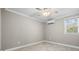 Neutral bedroom featuring tile floors, fan, and window for natural light at 615 N 17Th Ave. N, Surfside Beach, SC 29575