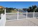 Balcony with white railings offering panoramic views of the water and neighborhood at 144 Waterway Crossing Ct., Little River, SC 29566