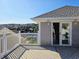 Balcony offering views of the neighborhood and water, along with a sliding glass door at 144 Waterway Crossing Ct., Little River, SC 29566