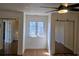 Bright bedroom features wood floors, a ceiling fan, and mirrored closet doors at 144 Waterway Crossing Ct., Little River, SC 29566