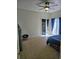 A bedroom features a ceiling fan, closet and balcony access with patio doors at 144 Waterway Crossing Ct., Little River, SC 29566