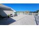 Deck featuring white railings, a gray floor, seating, and views of the surrounding community at 144 Waterway Crossing Ct., Little River, SC 29566
