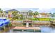 Waterfront home featuring a private dock with a wooden deck and access to the channel at 144 Waterway Crossing Ct., Little River, SC 29566