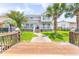 Beautiful two-story waterfront home with a deck, lawn, and a private dock at 144 Waterway Crossing Ct., Little River, SC 29566