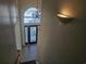Elegant foyer with staircase, decorative lighting, and tile flooring at 144 Waterway Crossing Ct., Little River, SC 29566