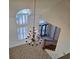 Grand foyer featuring a large chandelier, staircase, and tiled flooring at 144 Waterway Crossing Ct., Little River, SC 29566