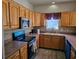 Traditional style kitchen with stainless steel microwave, wood cabinets and counterspace at 144 Waterway Crossing Ct., Little River, SC 29566