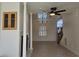 Spacious open-concept living area with tile floors, fireplace, chandelier and lots of natural light at 144 Waterway Crossing Ct., Little River, SC 29566
