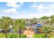 Scenic water view from the property, featuring boat docks and lush trees surrounding the waterway at 144 Waterway Crossing Ct., Little River, SC 29566
