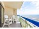 Balcony with ocean view and white chairs at 2500 Ocean Blvd. N # 1014, North Myrtle Beach, SC 29582