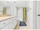 Bathroom with tub shower, vanity, and tiled floor at 2500 Ocean Blvd. N # 1014, North Myrtle Beach, SC 29582