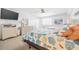 Bedroom with a queen bed, TV, dresser, and coastal decor at 2500 Ocean Blvd. N # 1014, North Myrtle Beach, SC 29582