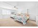 Bright bedroom with two twin beds, ceiling fan, and coastal decor at 2500 Ocean Blvd. N # 1014, North Myrtle Beach, SC 29582
