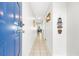 Bright entry hallway with tiled floor and beach decor at 2500 Ocean Blvd. N # 1014, North Myrtle Beach, SC 29582
