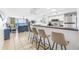 Open concept kitchen with island seating, stainless steel appliances, and ocean views at 2500 Ocean Blvd. N # 1014, North Myrtle Beach, SC 29582
