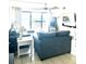 Living room with ocean view and comfy seating at 2500 Ocean Blvd. N # 1014, North Myrtle Beach, SC 29582