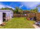 Spacious backyard with a storage shed and wooden fence at 705 White Oak Dr., Johnsonville, SC 29555