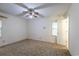 Cozy bedroom with carpet, light walls, a ceiling fan, and two windows, offering ample natural light at 705 White Oak Dr., Johnsonville, SC 29555