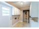 Laundry room with built-in cabinetry and exterior access at 705 White Oak Dr., Johnsonville, SC 29555