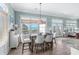 Coastal dining area with a wooden table and ocean views at 5207 Ocean Blvd. N, North Myrtle Beach, SC 29582