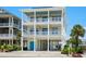 Three-story beach house with multiple balconies and ocean views at 5207 Ocean Blvd. N, North Myrtle Beach, SC 29582