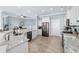 Modern kitchen featuring a large island, stainless steel appliances, and granite countertops at 5207 Ocean Blvd. N, North Myrtle Beach, SC 29582