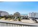 Stunning ocean view from a balcony, showing beach and houses at 5207 Ocean Blvd. N, North Myrtle Beach, SC 29582