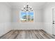 Bright dining room with chandelier and wainscoting at 1405 Crooked Hook Rd., North Myrtle Beach, SC 29582