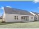 House exterior with gray siding and covered patio at 1405 Crooked Hook Rd., North Myrtle Beach, SC 29582