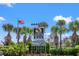 Welcome to North Myrtle Beach, South Carolina, sign with palm trees and American flag at 1405 Crooked Hook Rd., North Myrtle Beach, SC 29582