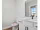 Modern bathroom with white vanity and black fixtures at 1509 Crooked Hook Rd., North Myrtle Beach, SC 29582