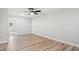 Well-lit bedroom with hardwood floors and ceiling fan at 1509 Crooked Hook Rd., North Myrtle Beach, SC 29582