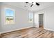 Spacious bedroom with hardwood floors and large windows at 1509 Crooked Hook Rd., North Myrtle Beach, SC 29582