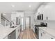 Modern kitchen with stainless steel appliances and white cabinetry at 1509 Crooked Hook Rd., North Myrtle Beach, SC 29582