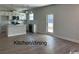 Kitchen with island, white cabinets, and stainless steel appliances at 1327 Winding Creek Way, Myrtle Beach, SC 29588